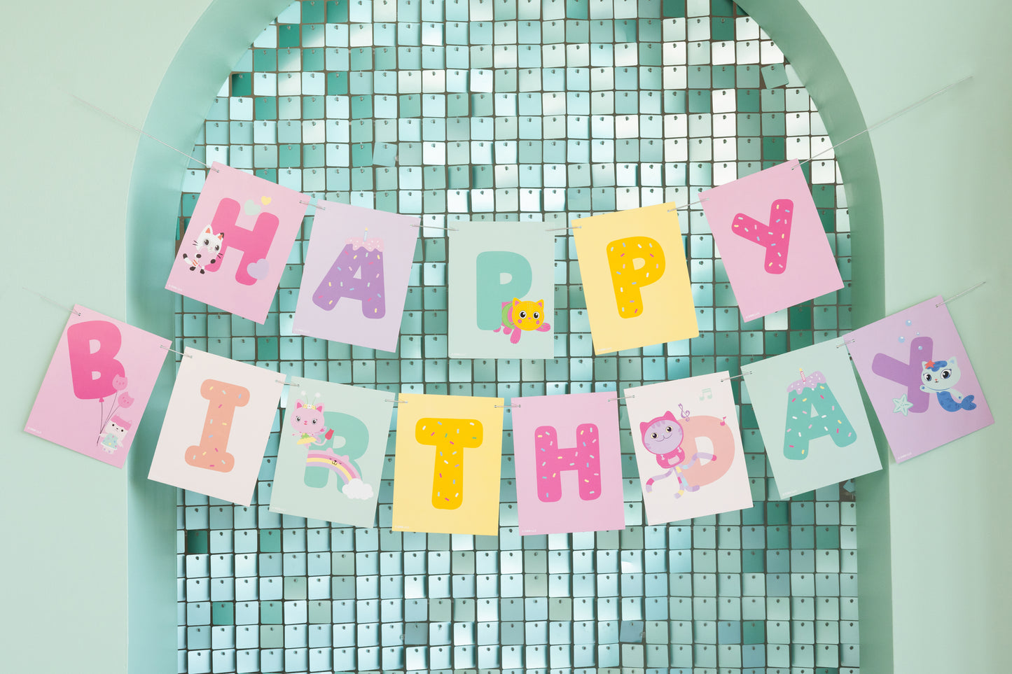 Colorful 'Happy Birthday' banner on a green lattice background