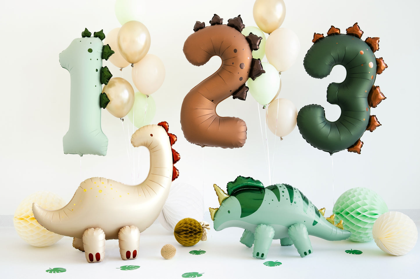 Dinosaur-shaped balloons with numbers 1, 2, and 3 on a white background