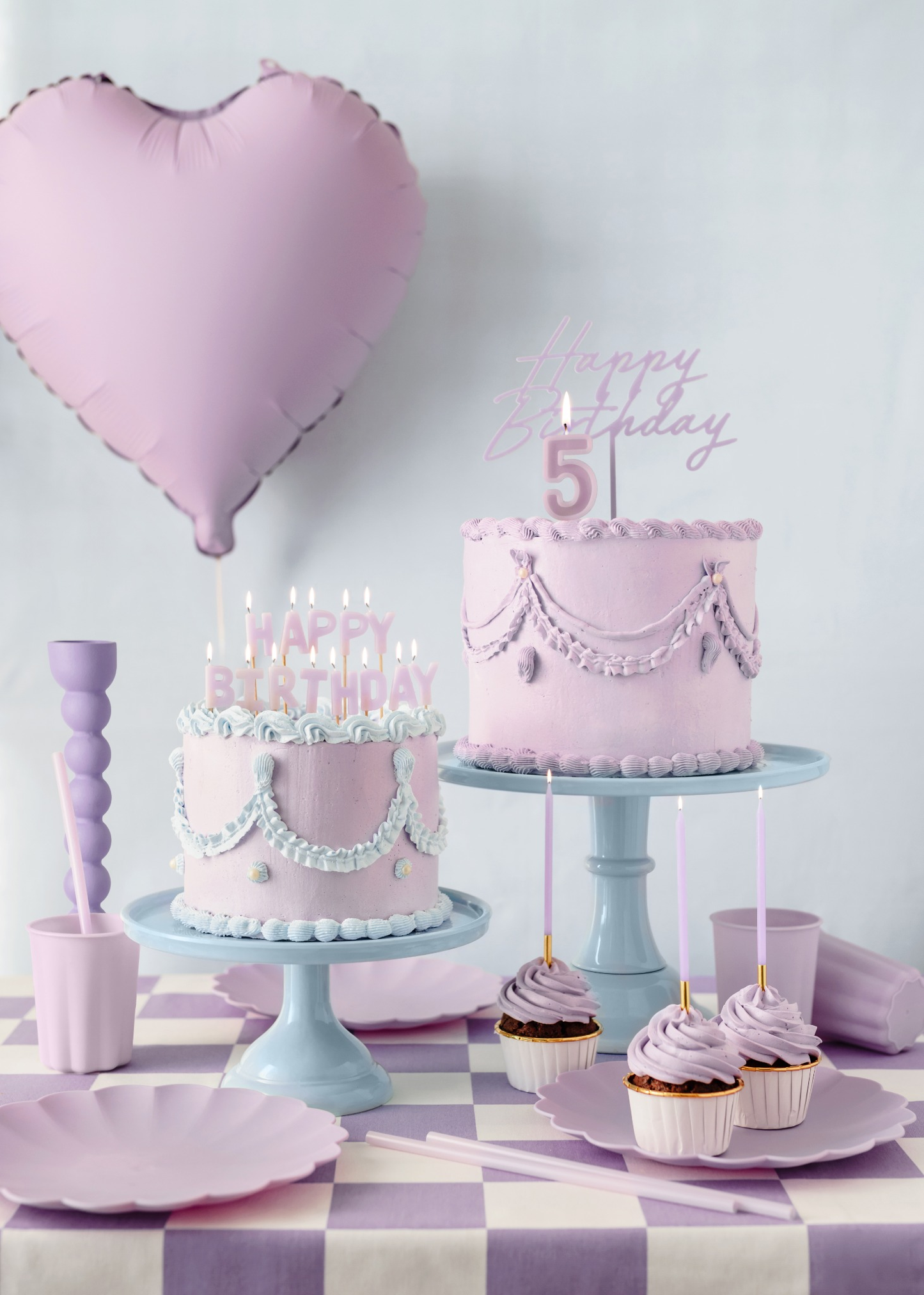 Lavender-themed birthday celebration tableware set with heart balloon, number 5 cake topper, cupcakes and pastel purple checkered tablecloth
