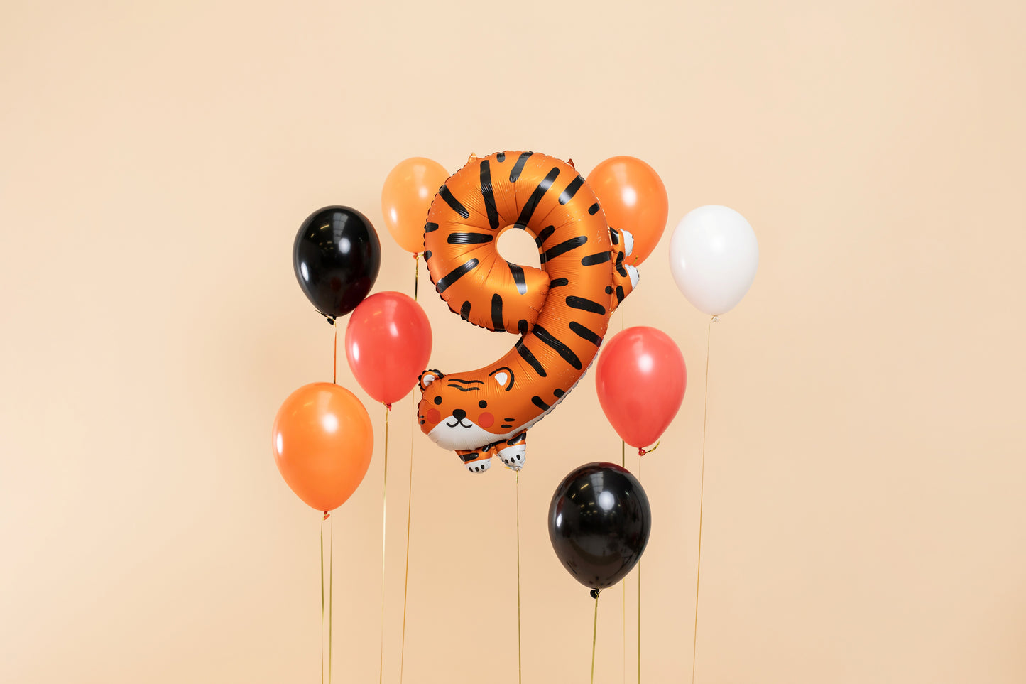 Tiger-shaped number 9 foil balloon for jungle-themed kids party