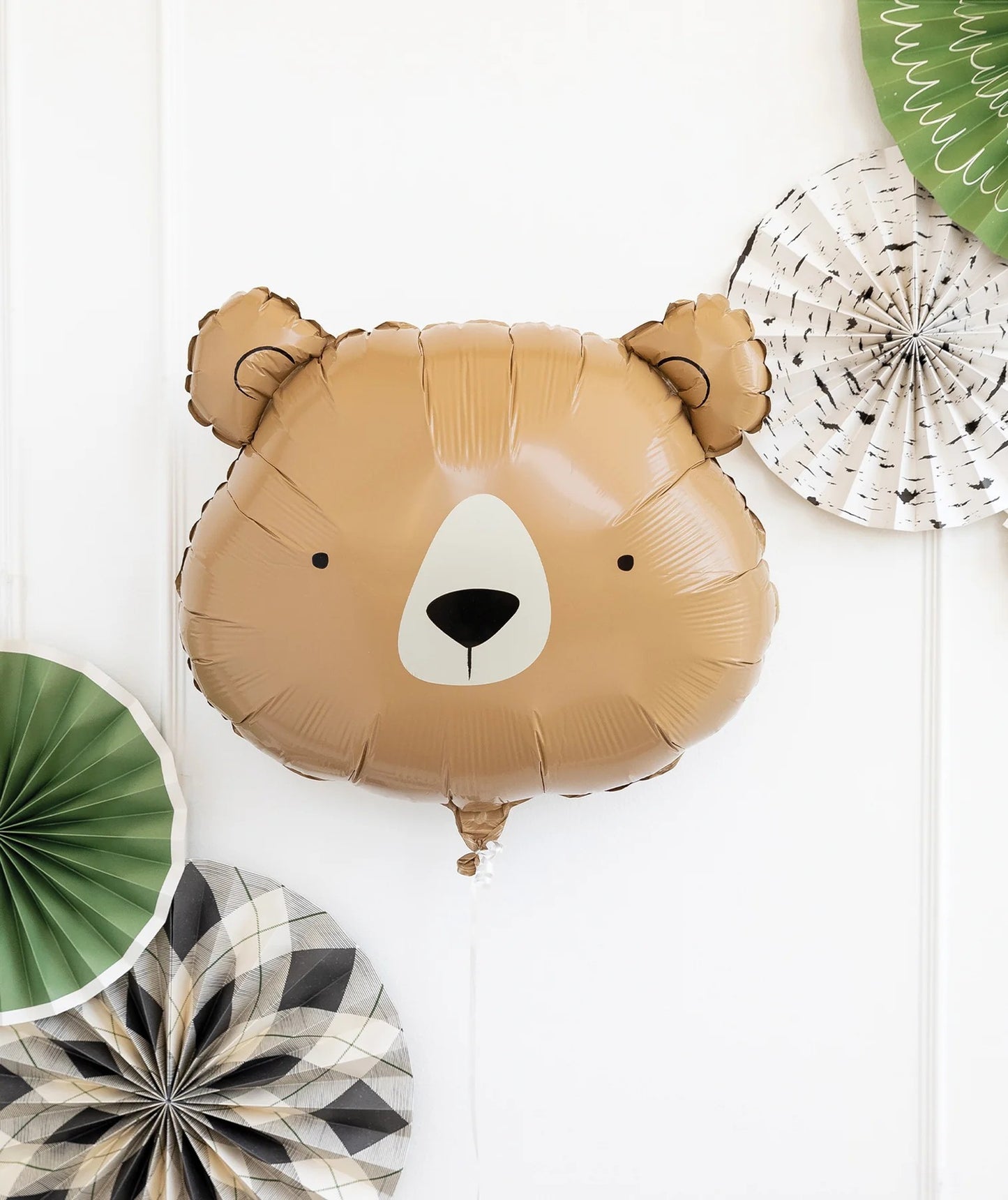 Bear-shaped balloon with decorative fans on a white background