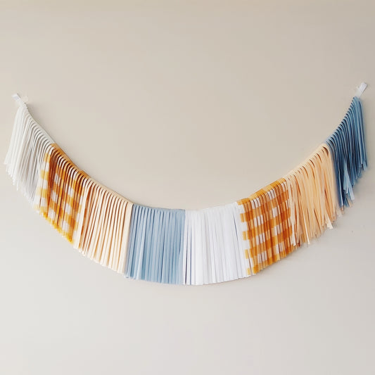 Decorative string banner with checkered pattern on a plain background