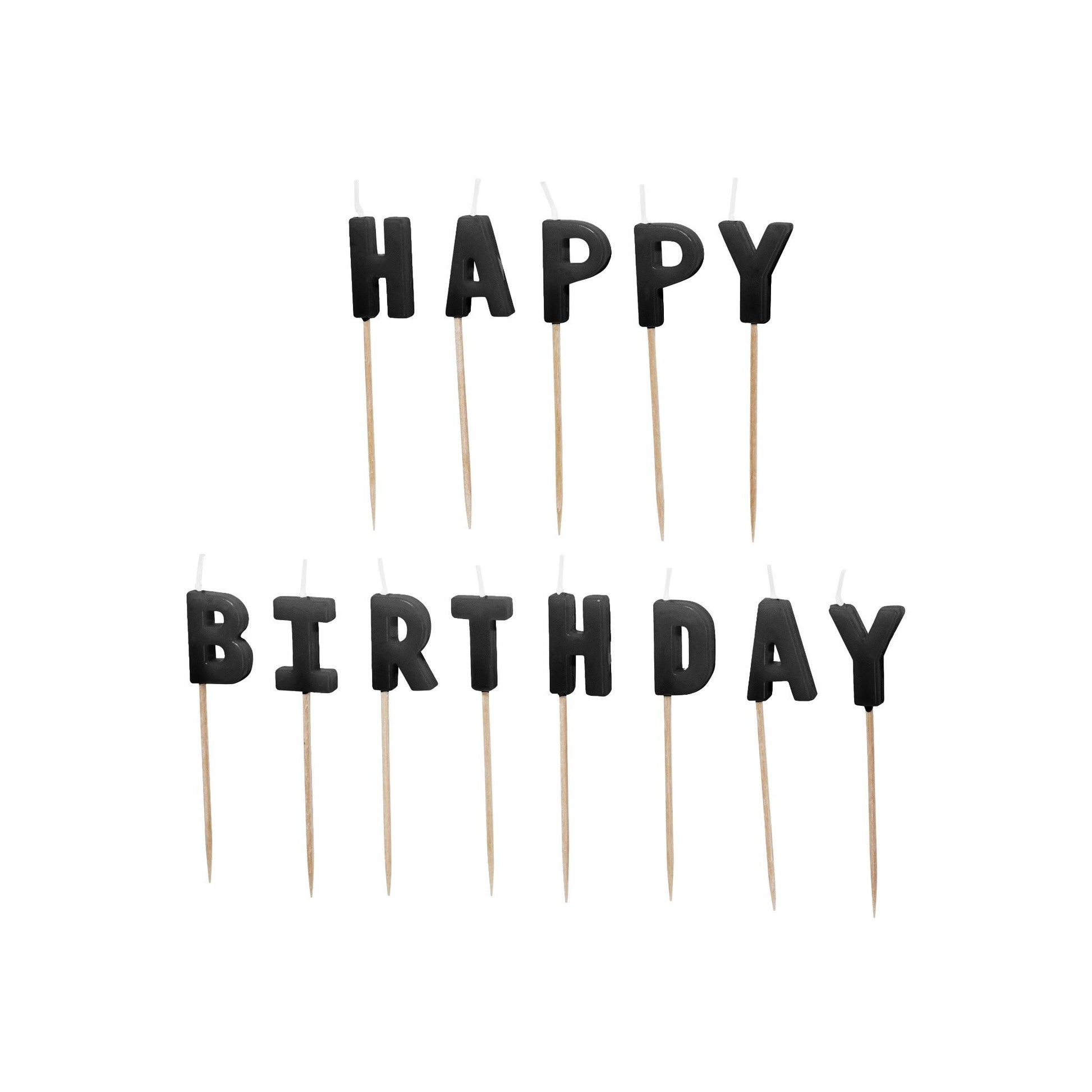 Black 'Happy Birthday' letter candles on wooden sticks against a white background