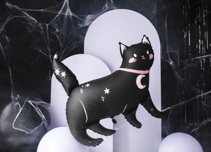 Black cat foil balloon with star and moon designs on a dark background