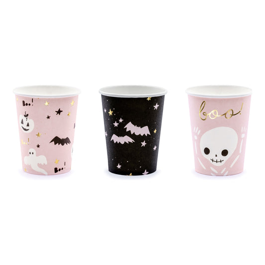 Three Halloween-themed paper cups with pink, black, and white designs on a white background.