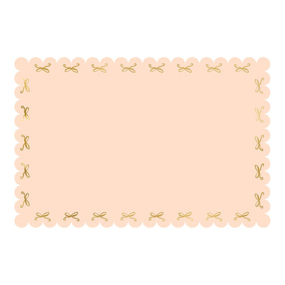Beige placemat with decorative gold border on a white background