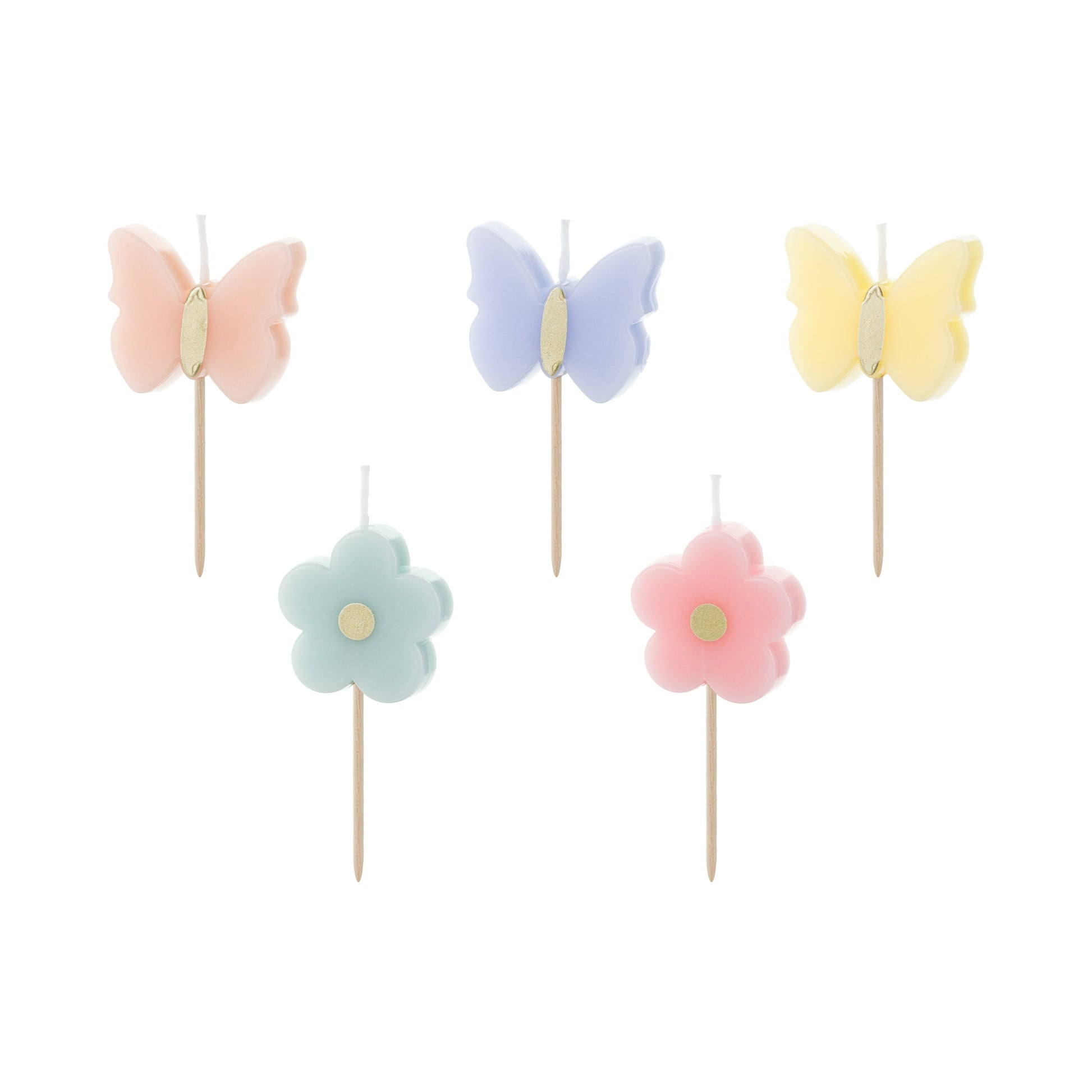 Set of pastel-colored butterfly and flower candles on sticks against a white background