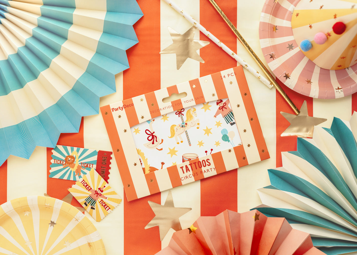Carnival-themed party supplies including paper fans, cards, and decorations on a colorful background.
