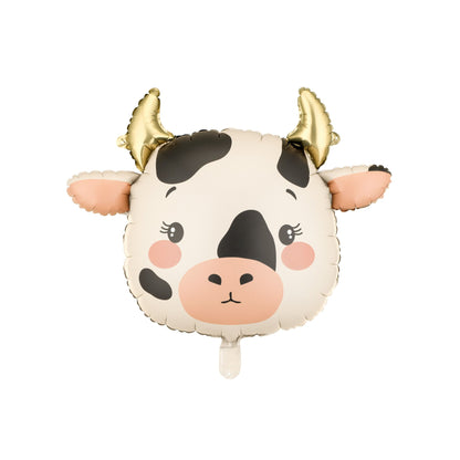 Cow-shaped balloon with gold horns on a white background