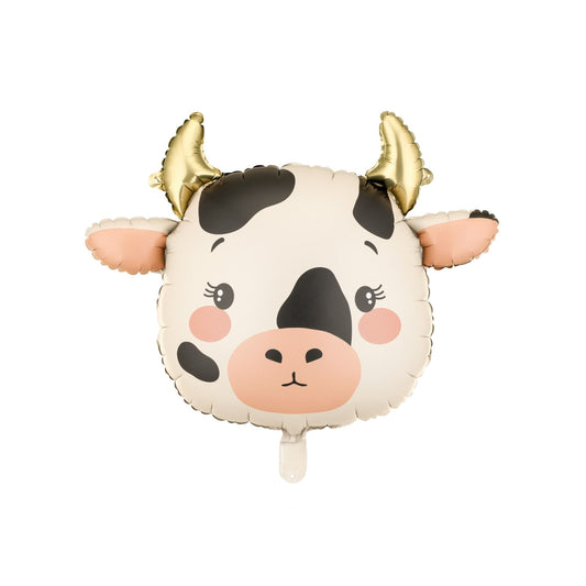 Cow-shaped balloon with gold horns on a white background