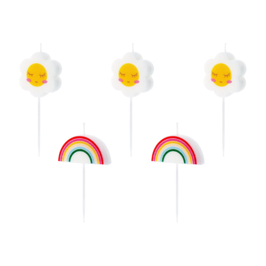 Three candles on sticks with faces and rainbows on a white background