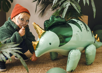 Green Triceratops foil balloon for dinosaur-themed birthday party