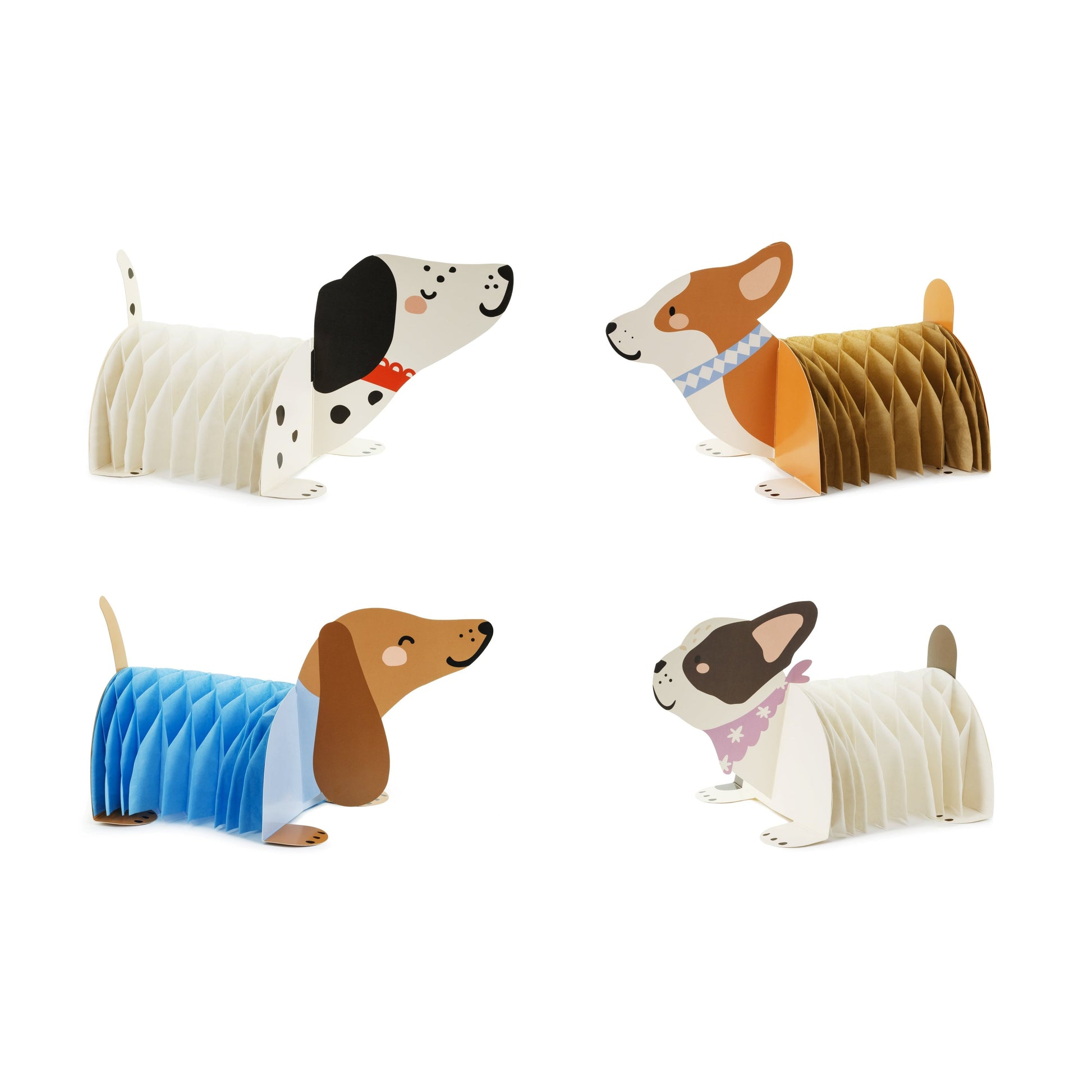 Set of four paper dog models with different breeds and colors on a white background