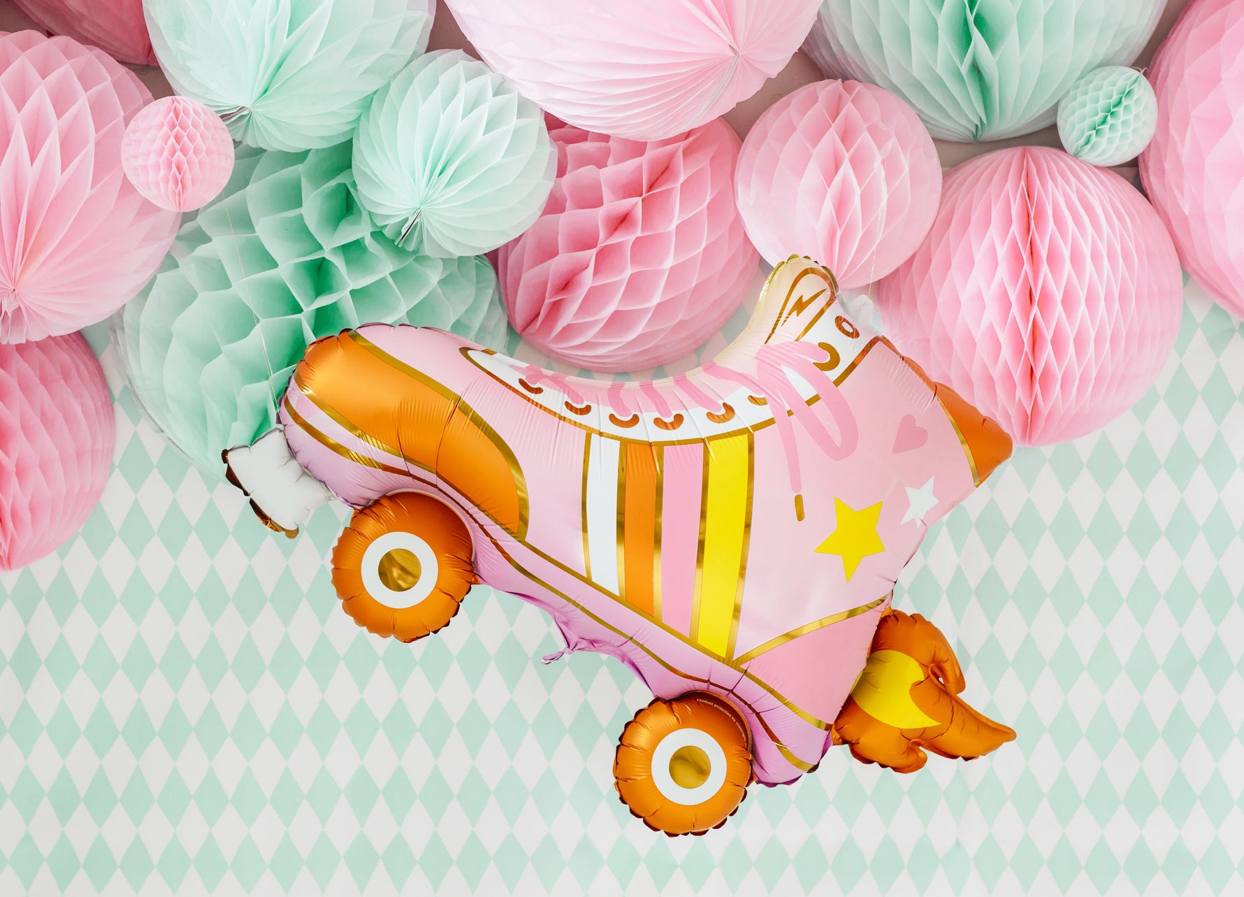 Pink and orange roller skate balloon and a pastel honeycombs