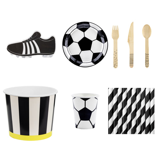 Black and white soccer-themed party supplies including cups, plates, and cutlery on a white background.
