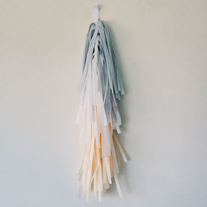 Colorful tassel decoration on a plain background