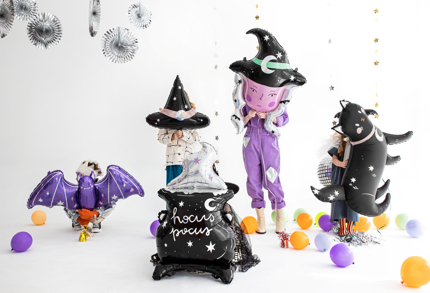Halloween-themed balloons including a witch, bat, and cat on a white background.
