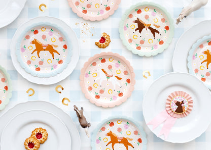 Horse themed paper plates with colorful border for party table
