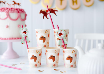 Paper cups and straws with horse toppers for kids birthday drinks