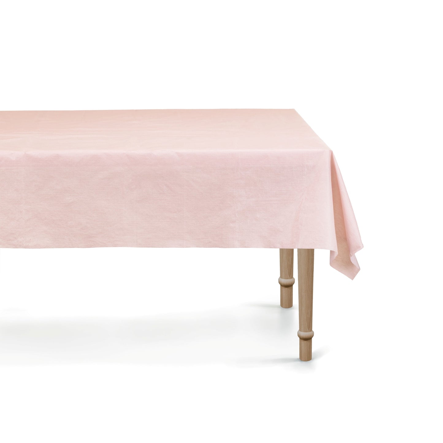 Pink tablecloth on a wooden table with a white background