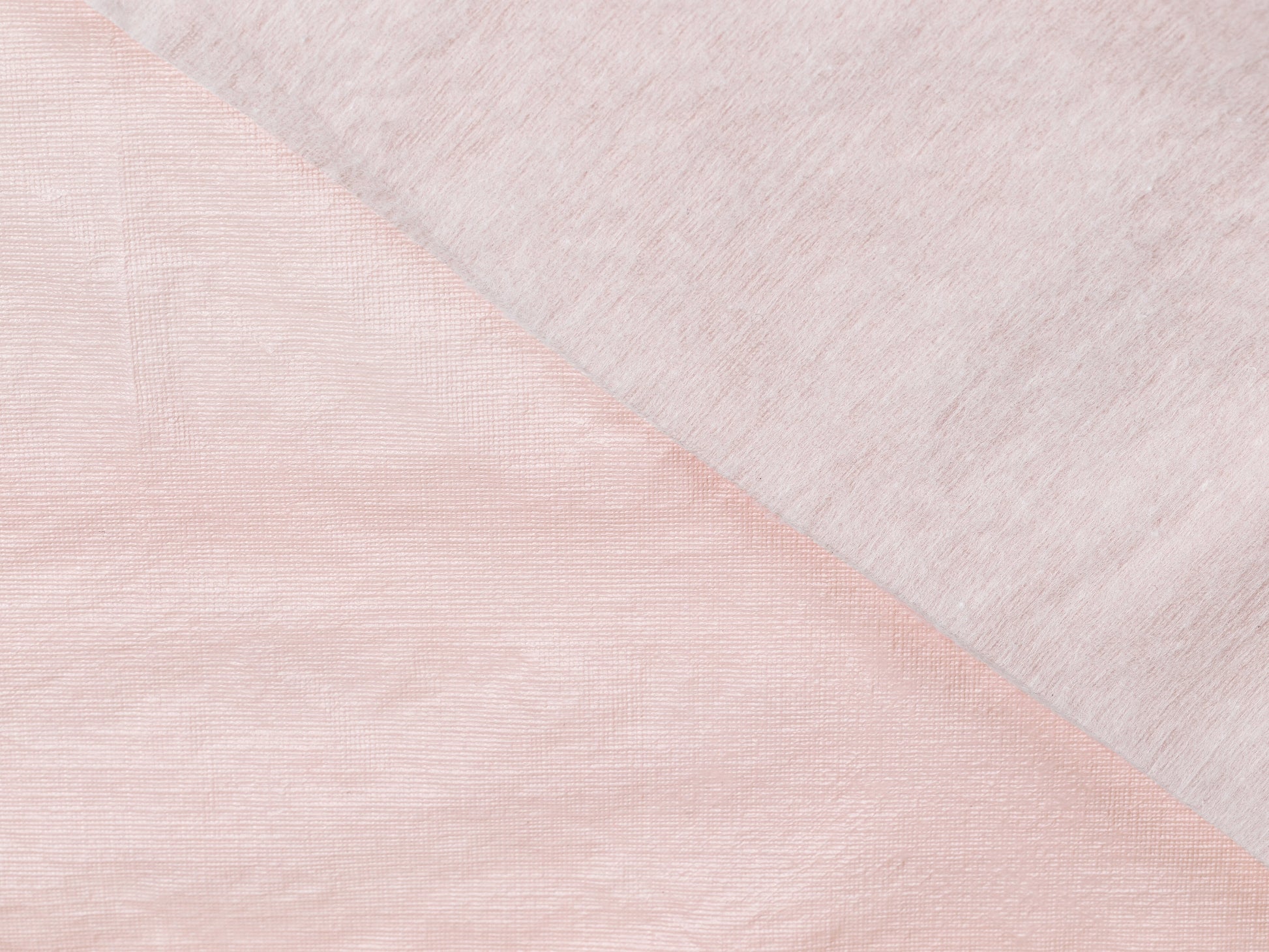 Close-up of a textured fabric pink tablecloth