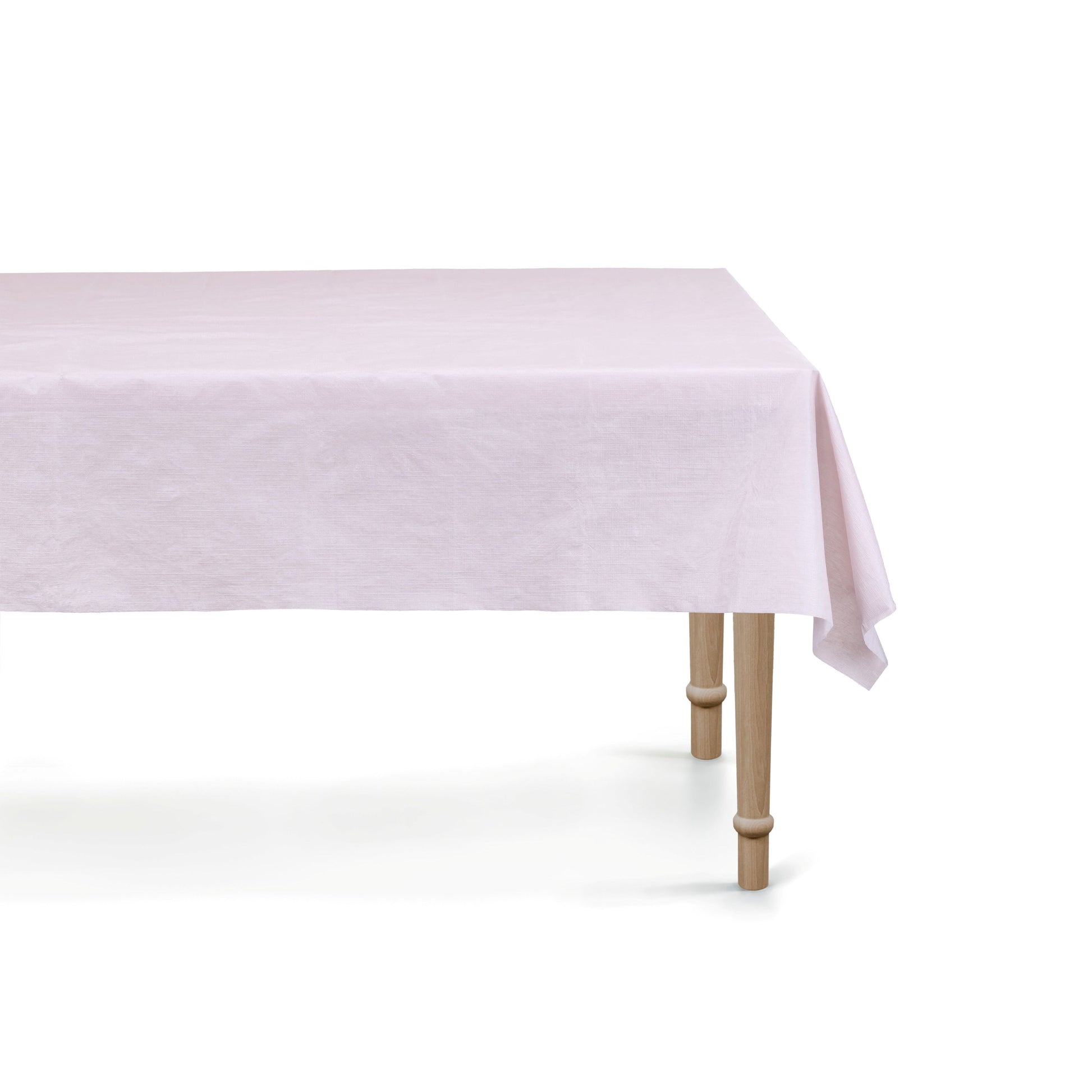 Light purple tablecloth on a wooden table with a white background