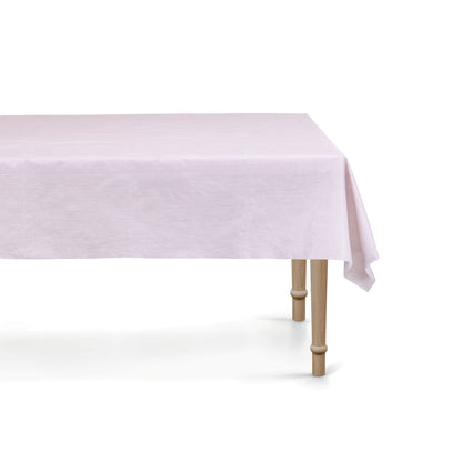 Light purple tablecloth on a wooden table with a white background
