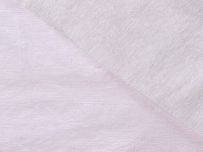 Close-up of textured white fabric with a diagonal pattern