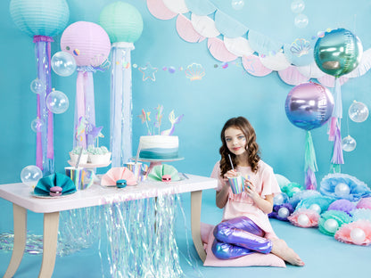 Pastel garland featuring seashell and star shapes — under the sea party banner.