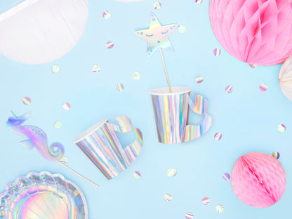 Iridescent paper cups with mermaid tail-shaped handles — ideal for kids' ocean-themed parties.