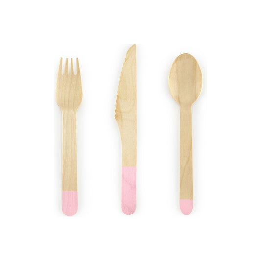 Set of wooden cutlery with pink accents on a white background