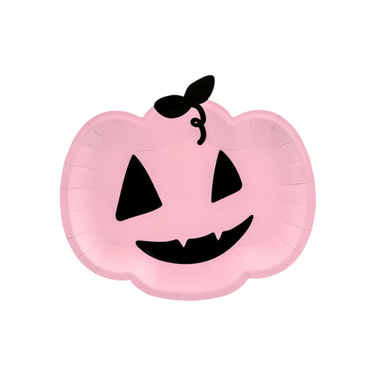 Pink balloon shaped like a pumpkin with a black face on a white background