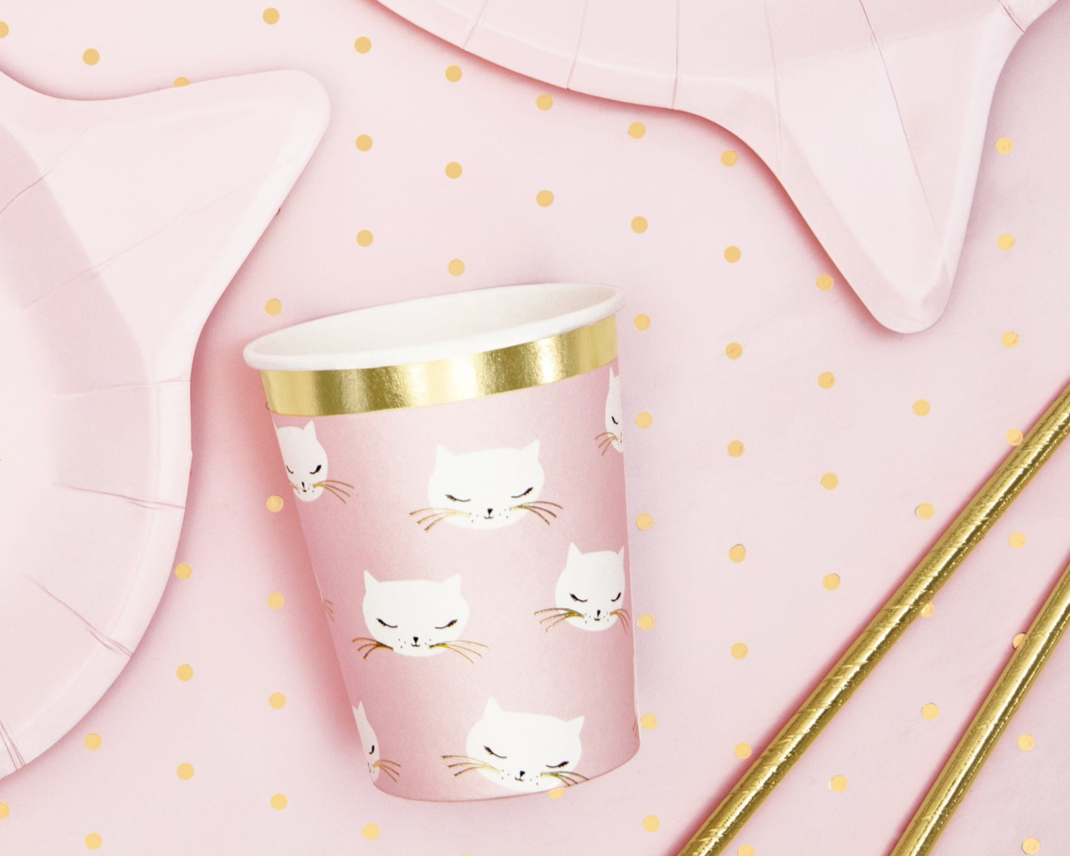 Paper cup with cat design with gold accents