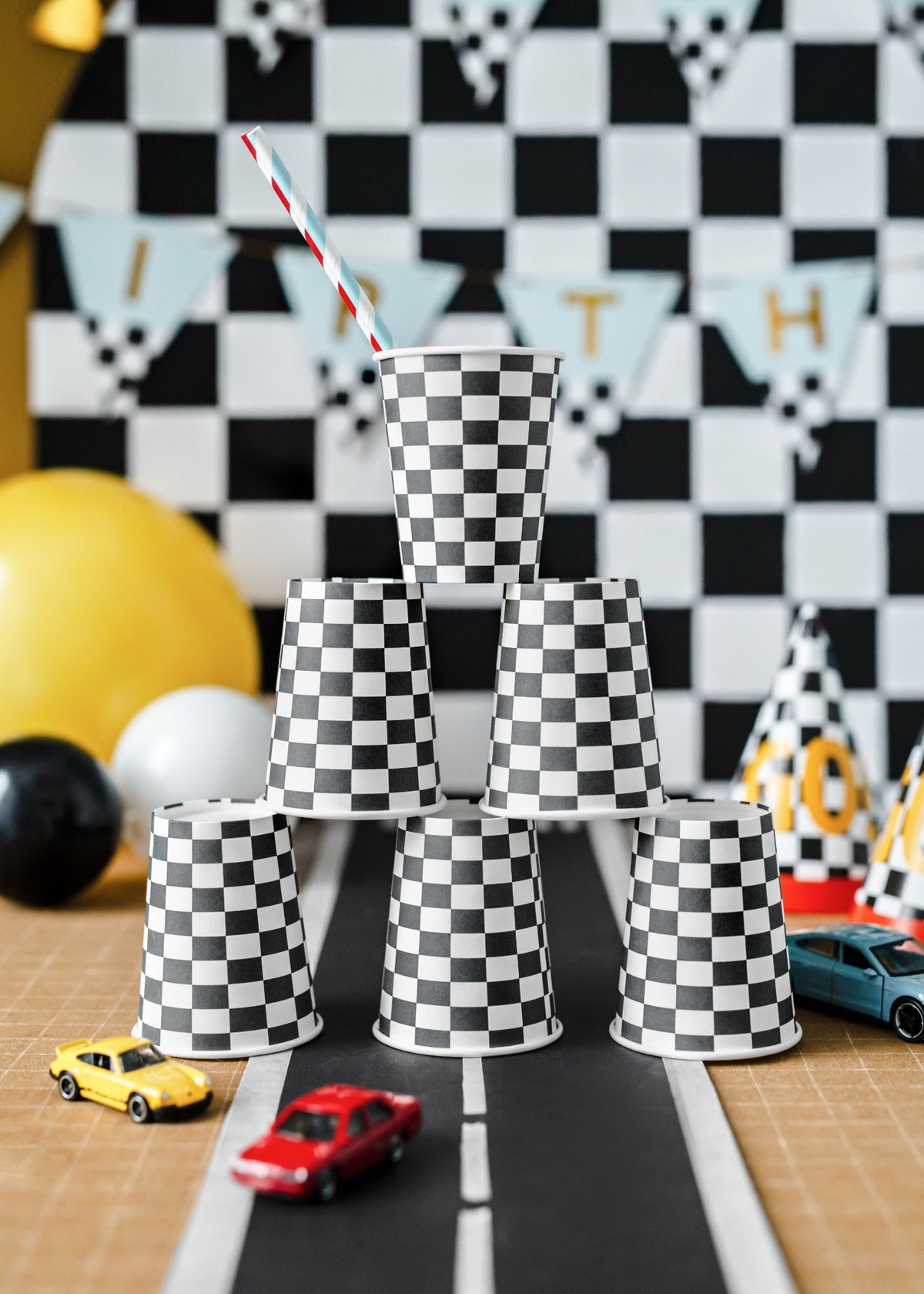 Racing themed black and white checkered paper cups.