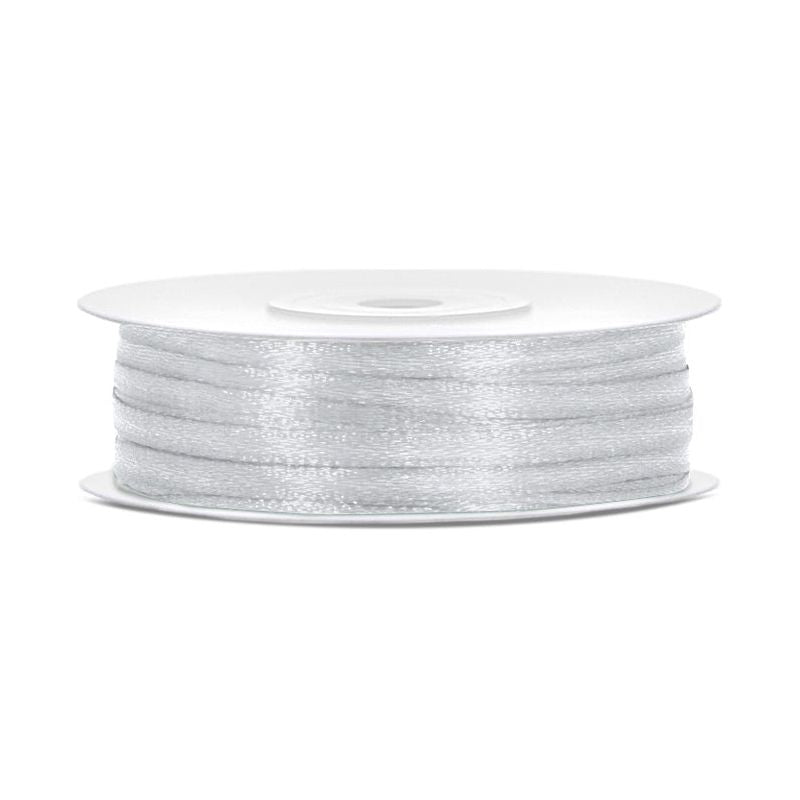 Spool of silver thread on a white background