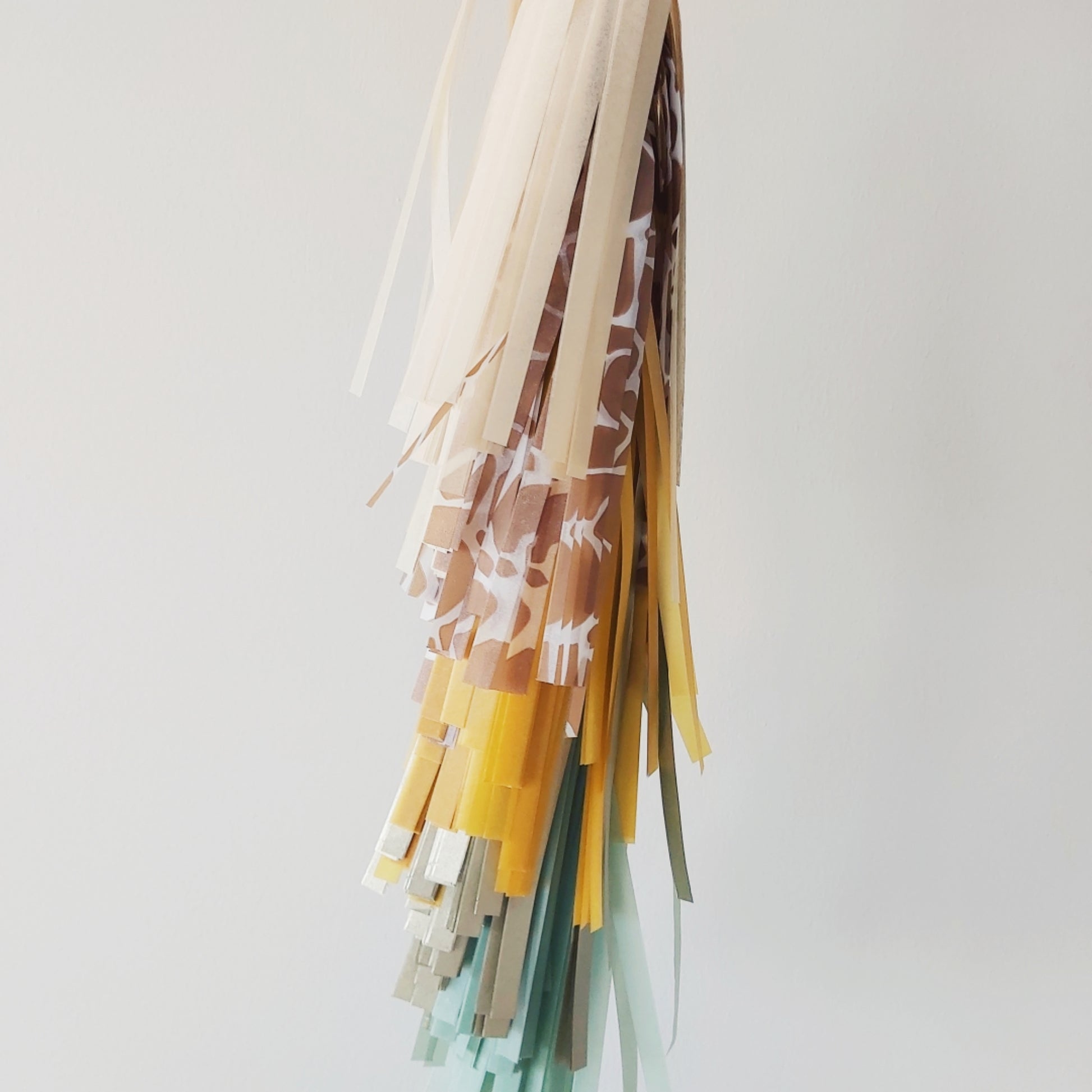 Colorful fabric tassels on a white background