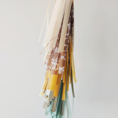 Colorful fabric tassels on a white background