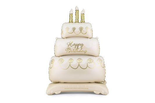 Inflatable birthday cake with candles on a white background