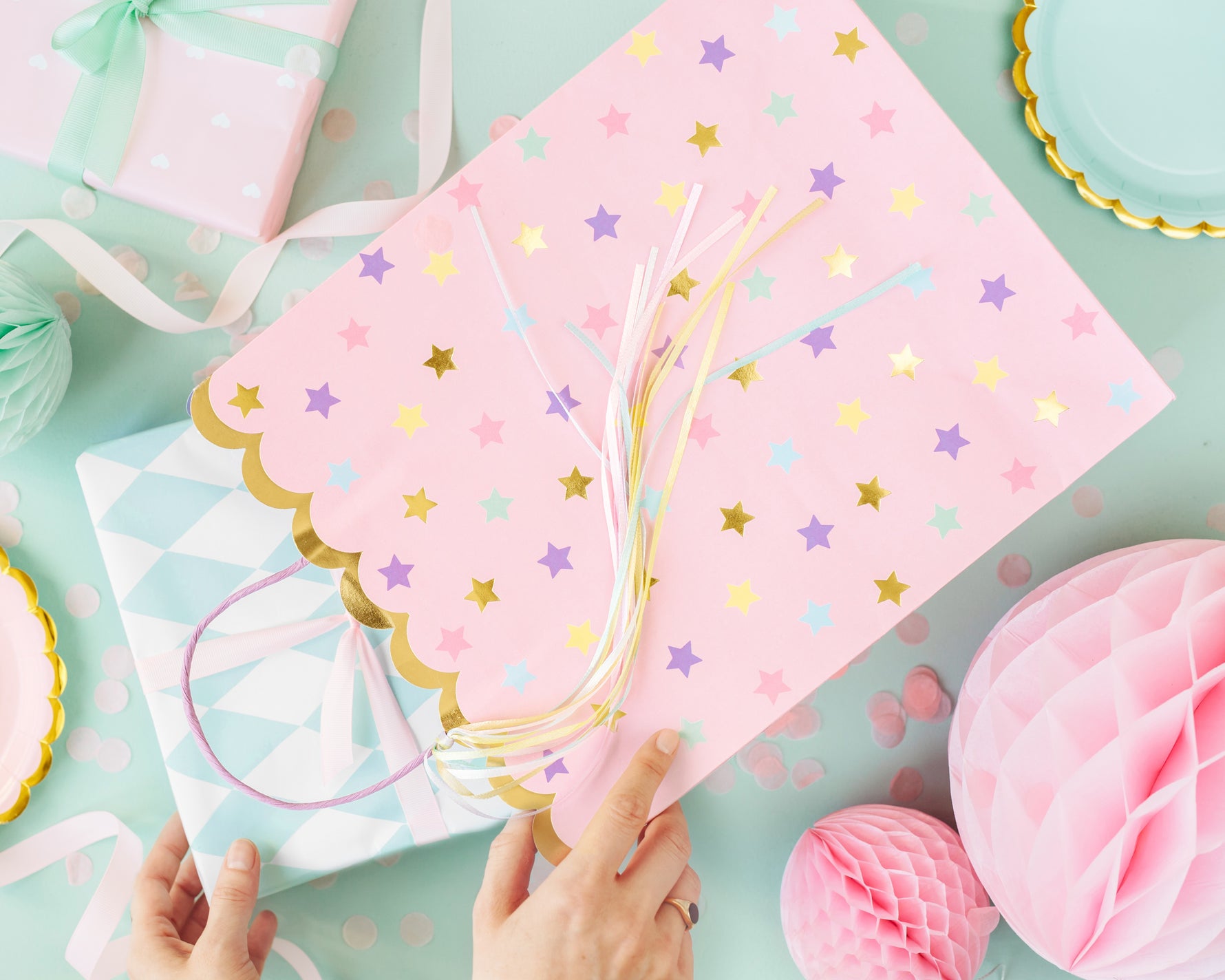 Pink paper bag with star patterns
