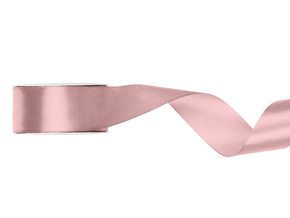 Pink satin ribbon on a white background