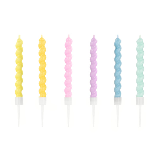 Set of six pastel-colored spiral candles on a white background