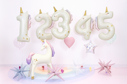 Unicorn-themed number balloons on a white background