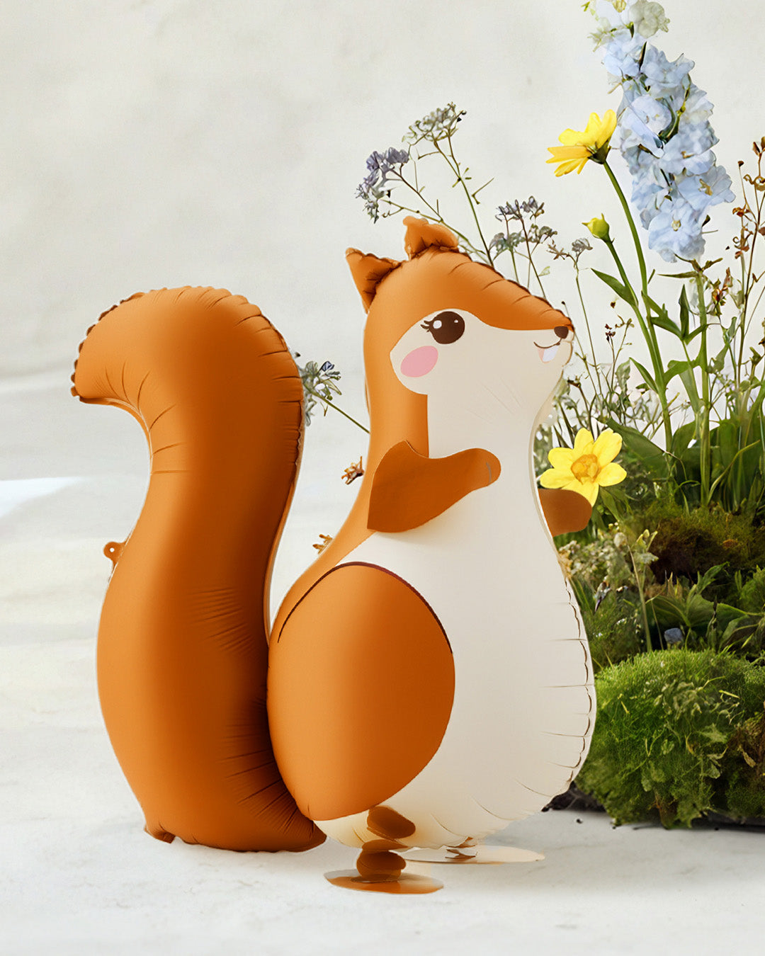 Walking Squirrel Foil Balloon with flowers and plants on a light background