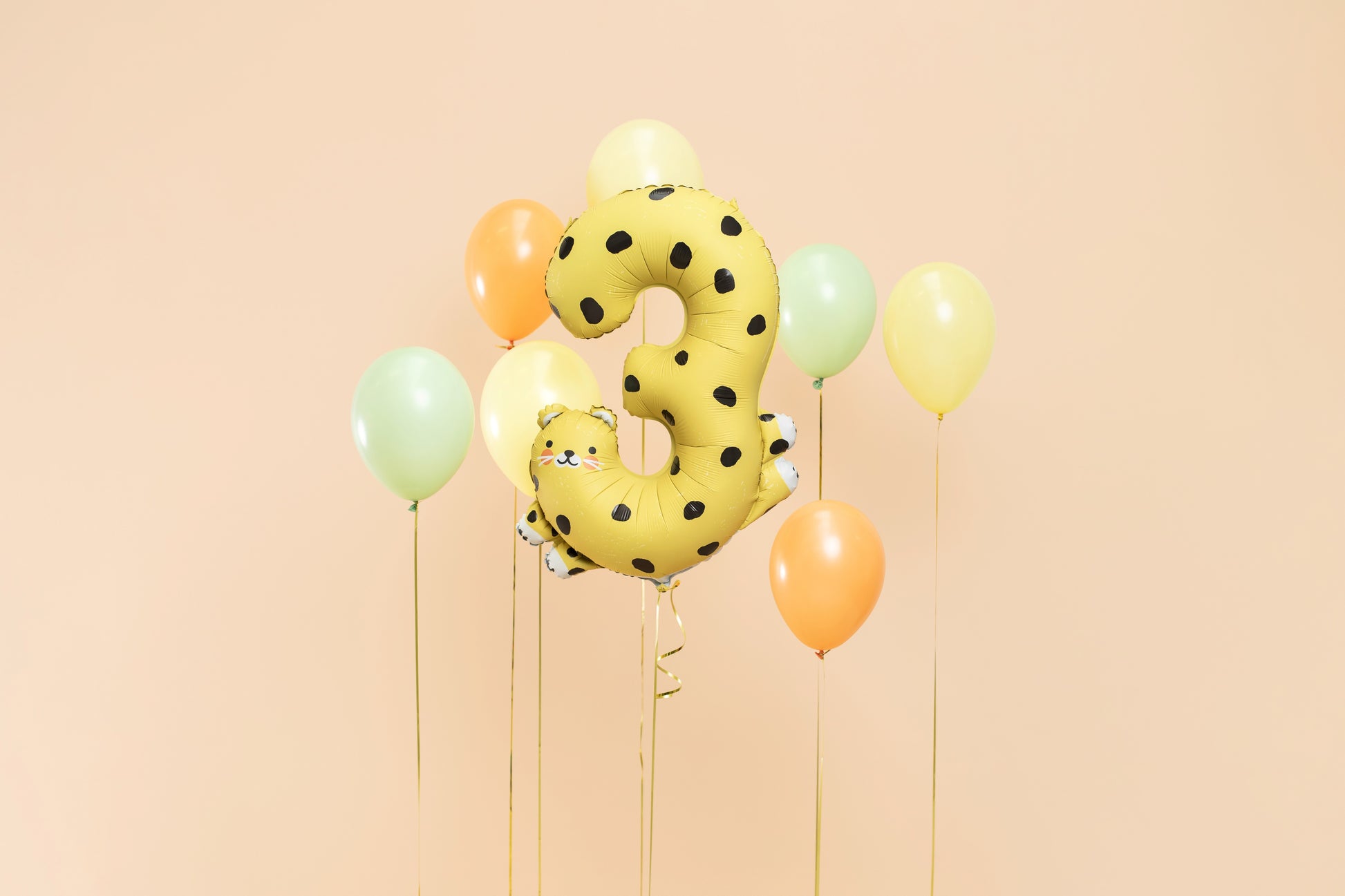 Cheetah-shaped number 3 foil balloon for jungle-themed birthday party
