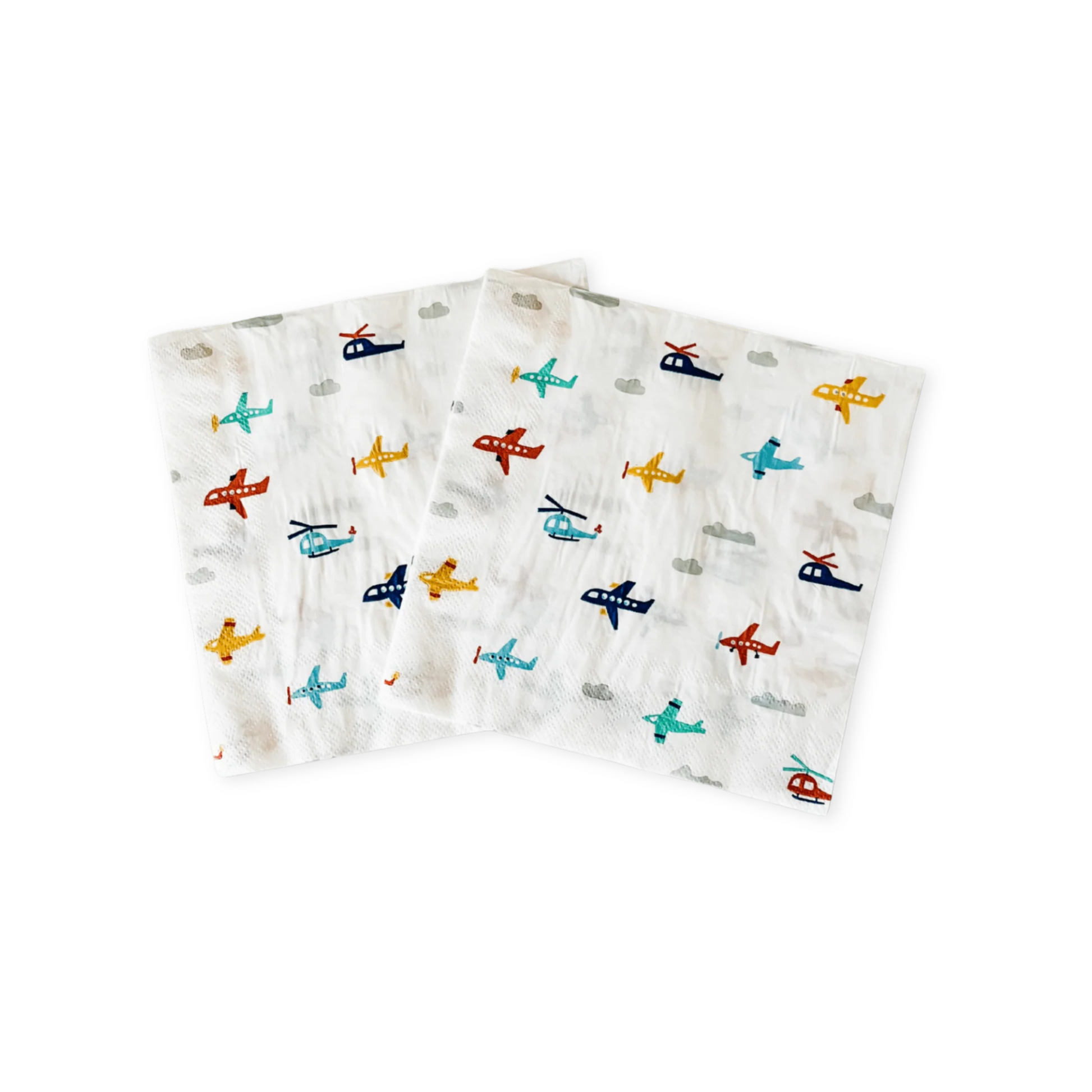 Two napkins with airplane and helicopter patterns on a white background