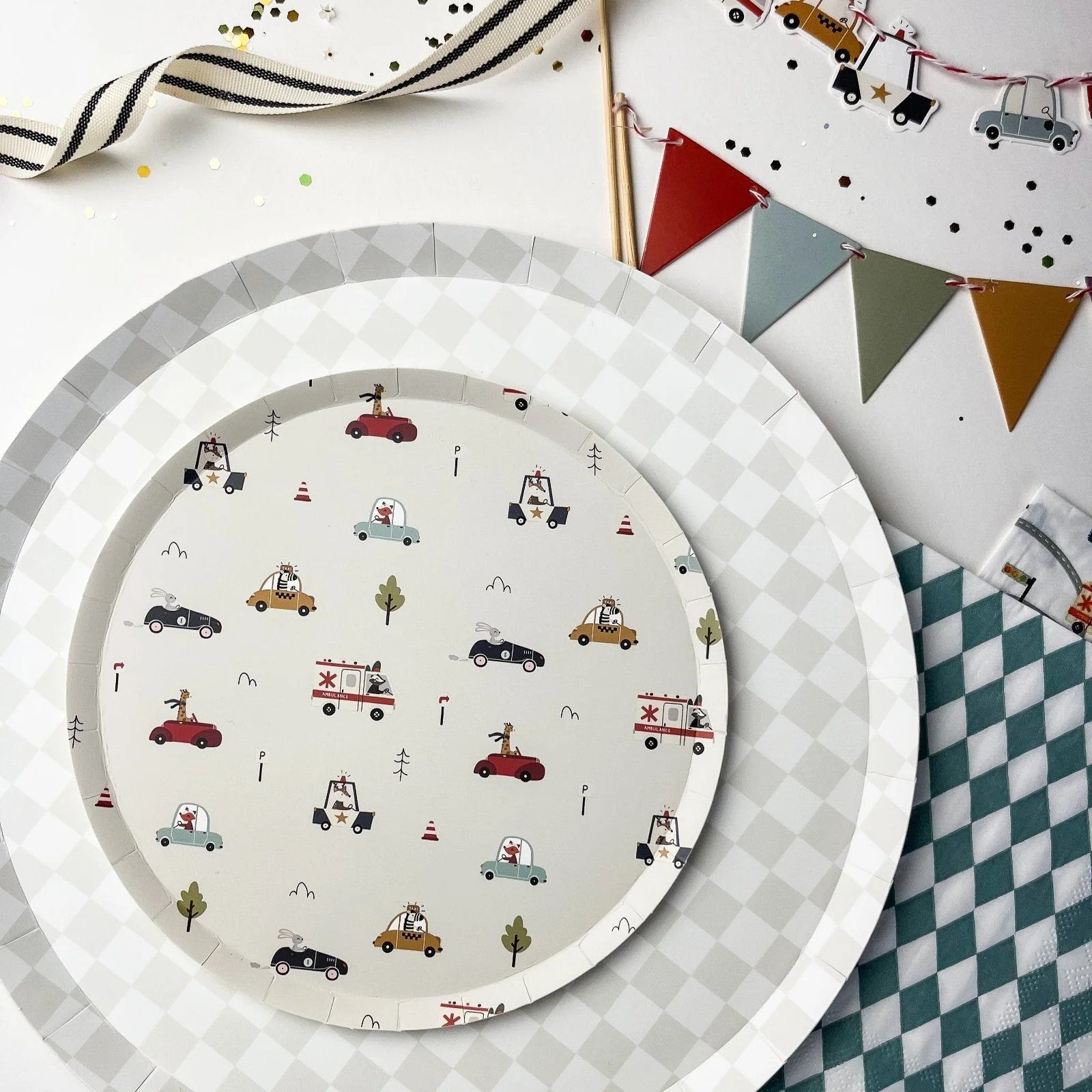 Round paper plate with vehicle pattern on a checkered surface