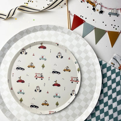 Round paper plate with vehicle pattern on a checkered surface