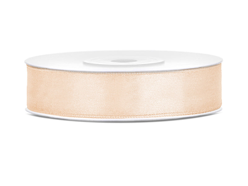 Roll of beige ribbon on a white background