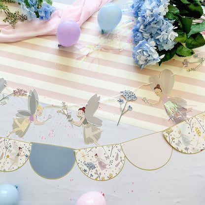 Decorative paper garland with fairy designs on a striped background