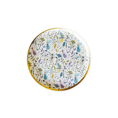 Round paper plate with butterfly and floral design on a white background